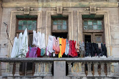 Colourful Laundry hangs on clothes lines over balconies in Vieja Habana, Cuba