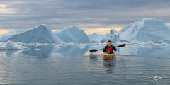 Kayaking amongst the immense icebergs of the Kangia Icefjord is an awe-inspiring and humbling experience