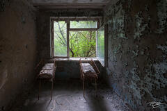 Two cribs in a room inside the Pripyat Hospital