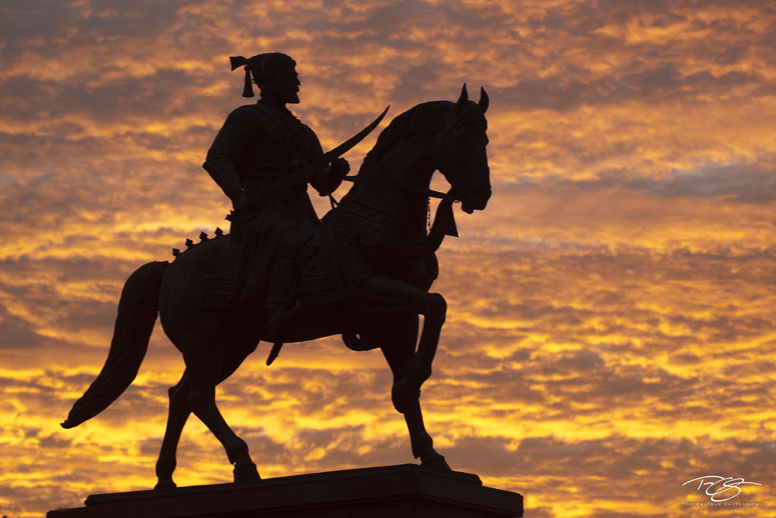 Conquest A silhouette of legendary Indian warrior Shivaji silhouettted against a fiery sky