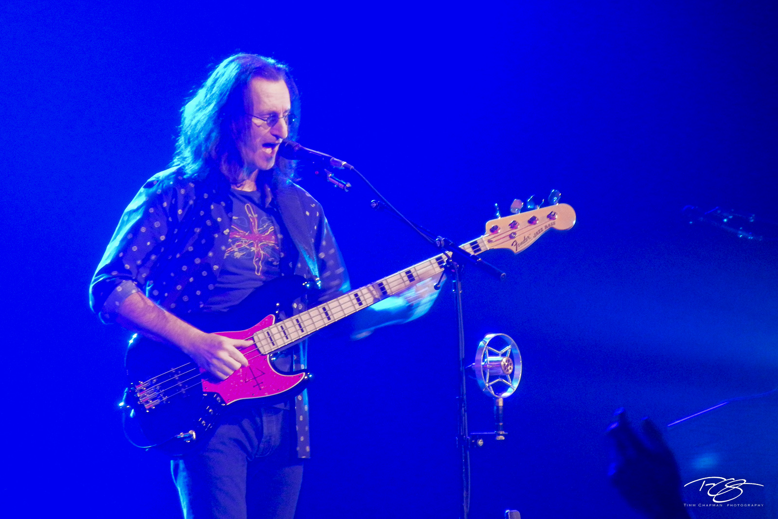 Geddy plays the Blues Geddy Lee is bathed in blue light whilst playing his Fender jazz bass