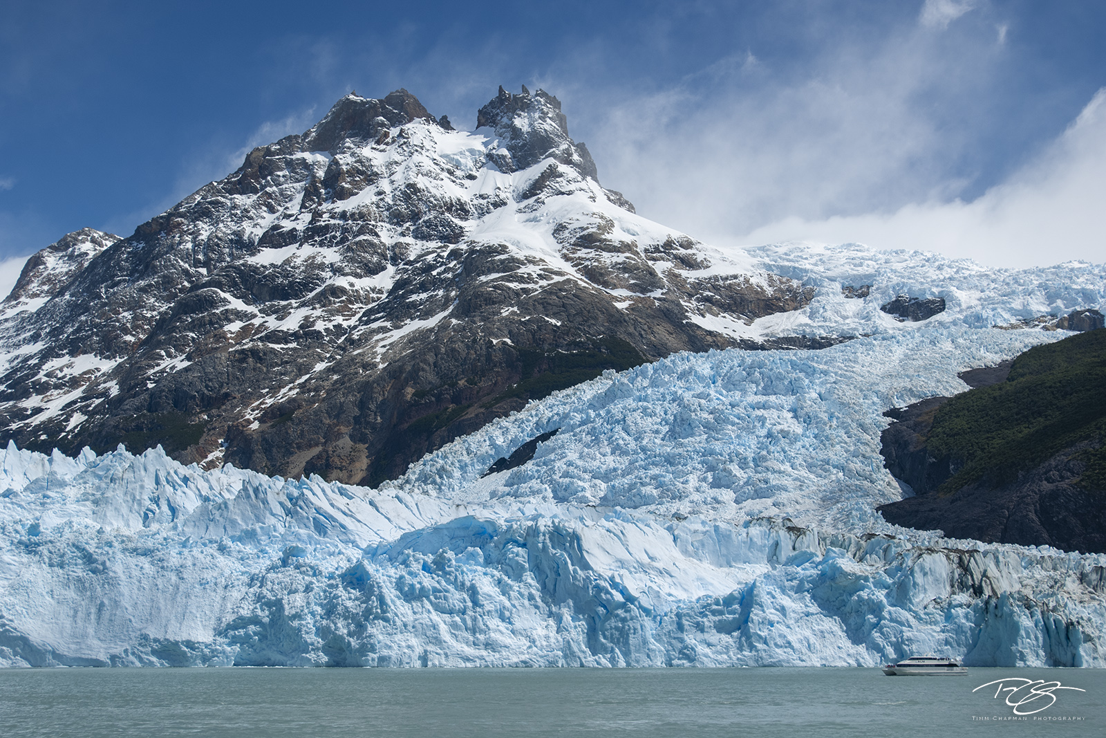 River of Ice Flowing from the Campo de Hielo Sur Icefield, Spegazzini Glacier winds its way arround Cerro Peineta before finally depositing...