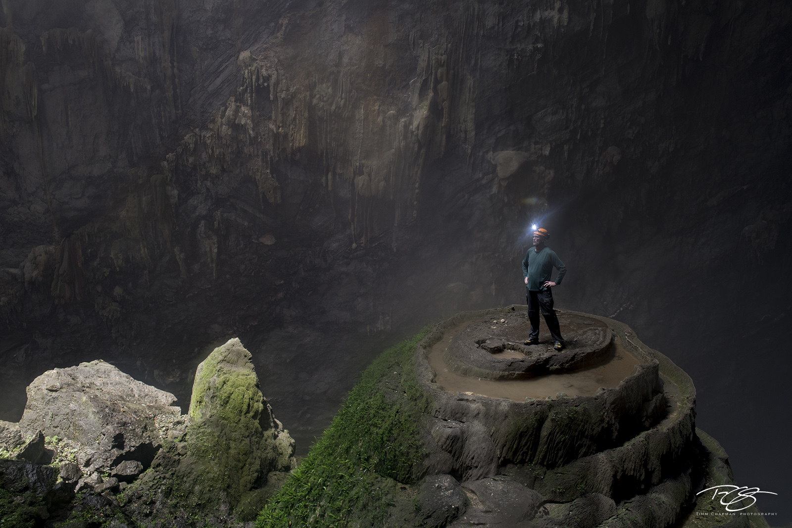 Awestruck A cave explorer perched atop a 75 metre stalagmite marvels at the immensity of Hang Son Ðoòng - the world's largest...