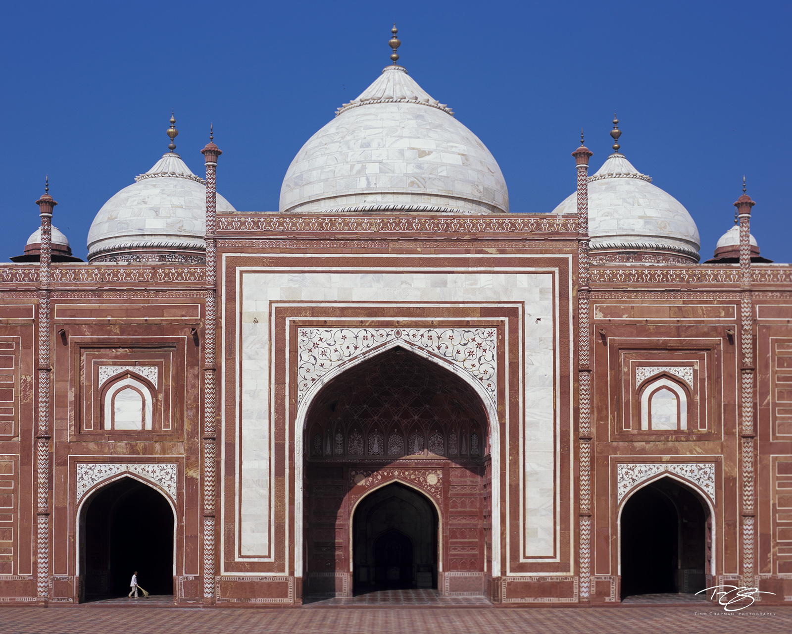 The Caretaker A caretaker sweeps clean the floor of the tripartite mosque near the Taj Mahal.