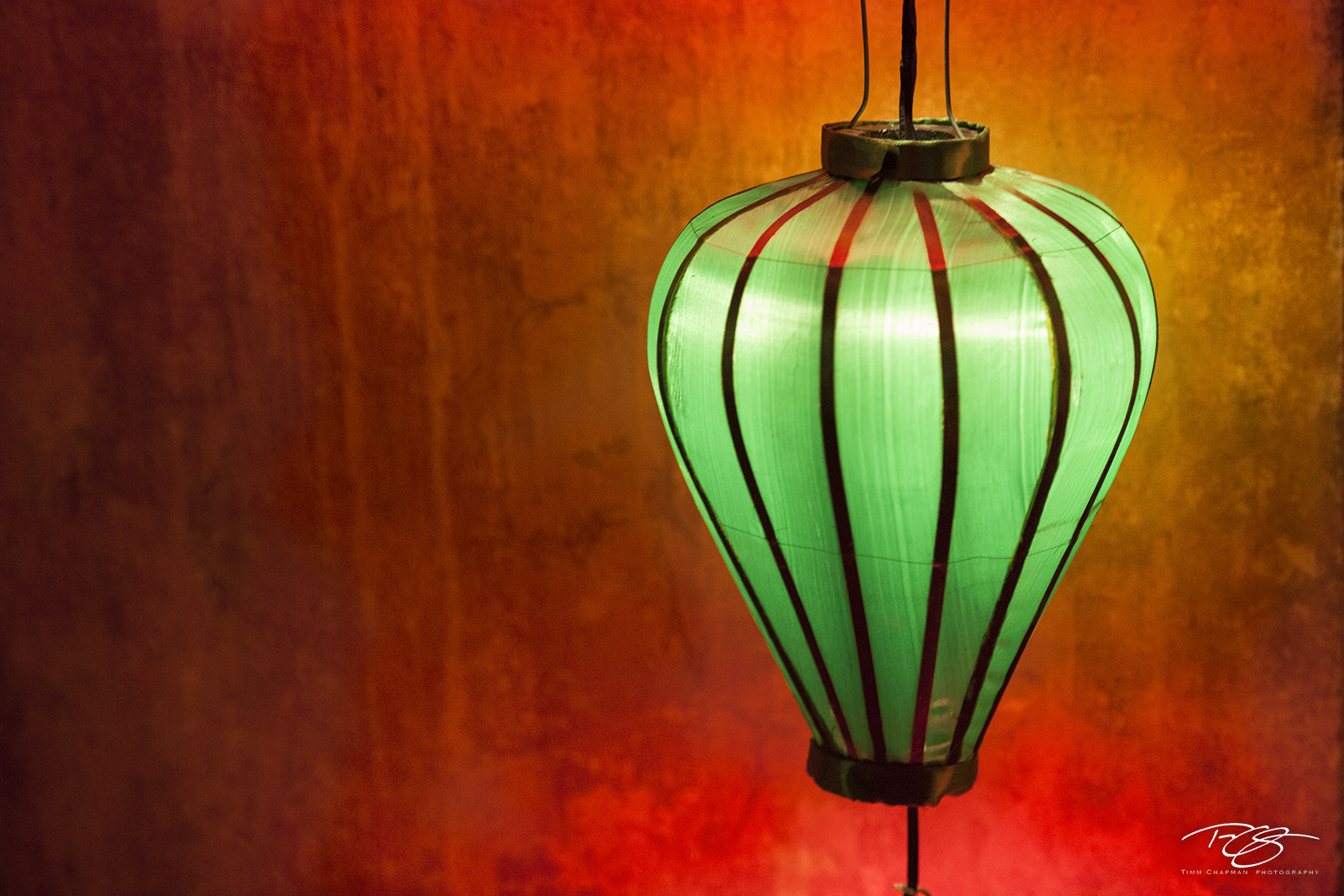 The Green Lantern A paper lantern provides a striking contrast against a warm background in the ancient trading port of Hoi-An