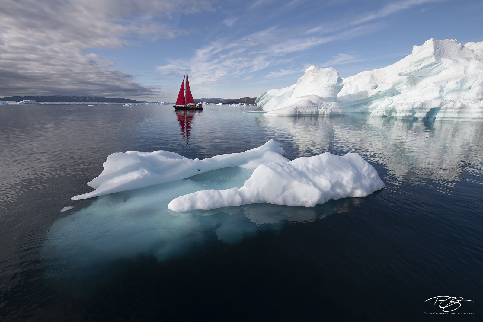 The Witness A sailboat bears witness to the mass of ice being calved from the Jakobshavn glacier in West Greenland